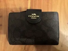 COACH 二つ折り財布 シグネチャー柄