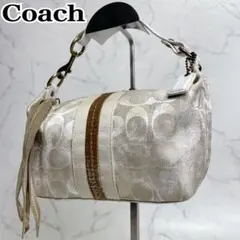 COACH アクセサリーポーチ シグネチャー タッセル ホワイトゴールド ミニ