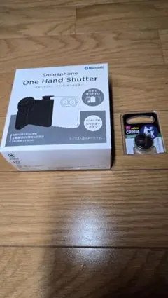 【新品未開封品】ダイソー　スマートフォンワンハンドシャッター　ボタン電池1個付のサムネイル