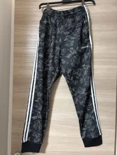 adidas✕DISNEYグーフィー総柄トラックパンツ ジャージパンツ M