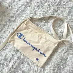 チャンピオンchampion生成りカラーショルダー美品旅行にもプラザのサムネイル