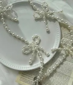 cuorequal パールリボンスマホショルダー