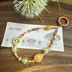 オレンジ系フラワーモチーフ携帯ストラップ