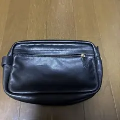 コーチの黒レザー クラッチバッグ