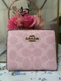 COACH 二つ折り財布 シグネチャー ピンクのサムネイル