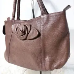 IBIZA】フラワーチャーム付きハンドバッグ ブラウン レザー フリル 