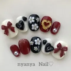 お色変更＆サイズ変更無料♪ ベリーショート　赤いリボンの白いお花ネイル♡