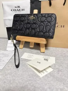 正規品COACH ブラック シグネチャー型押し長財布ホース&キャリッジ