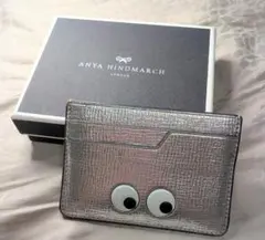 アニヤハインドマーチ 長財布 シルバー タッセル Eyes ラウンド
