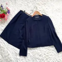 グリーンレーベルリラクシングノーカラーラッセルバスケット スカートスーツ