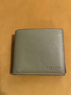 COACH 薄緑二つ折り財布 フラップポケット付きのサムネイル