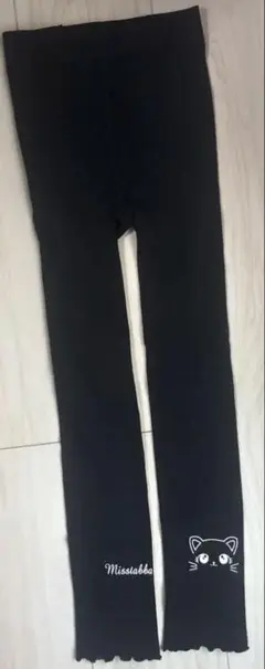 猫顔プリント フリル裾タイツ 黒