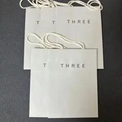three 紙袋　ショッパーのサムネイル