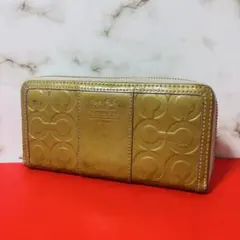 0089 COACH ゴールド エナメル ラウンドファスナー 長財布