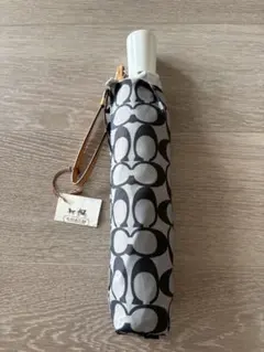 【お値下げ】 COACH 折りたたみ傘　シグネチャー柄　ワンタッチオープン式のサムネイル