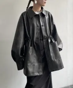 AIC. クラッシュ レザー ドローストリング オーバージャケット