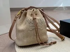PRADA ラフィア巾着バッグ ベージュ 三角プレート サマーバッグ