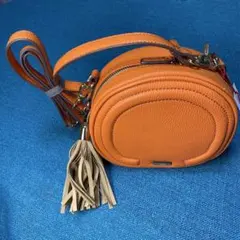サ*ト様 オレンジ円形　レザーショルダーバッグ　合成革皮