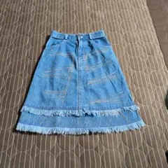P.G. フリンジ付きデニムスカート