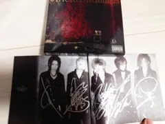 d*7様 the GazettE STACKED RUBBISH 直筆サイン入り - メルカリ