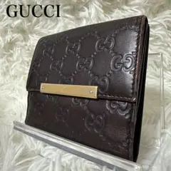 GUCCI 二つ折り財布 シマ ゴールド金具 型押し レザー ブラウン