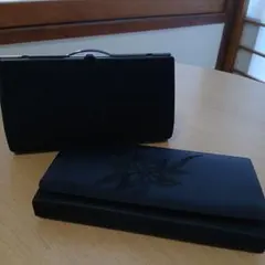 黒いストライプ模様の和装用バッグ