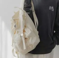 ニコアンド　アイボリーリュック　フロントポケット付き