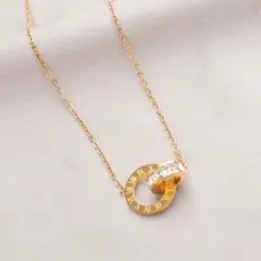 インターロッキング リング ネックレス ゴールド ローマ数字 クリスタル