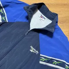 【美品90s】 Reebokネイビーロゴ刺繍ナイロンジャケット紺XL相当テープ