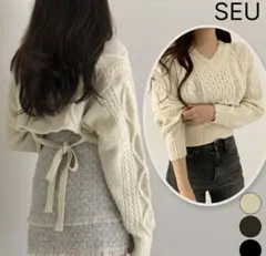 ケーブル編みニットセーター　アイボリー　バッグリボン　きれいめ　カジュアル