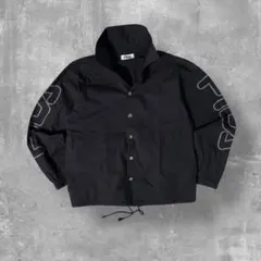 FILA 短丈コーチジャケット ドローコード ブラック テック系のサムネイル