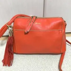 niko and… タッセル付きお財布ショルダーバッグ　オレンジ