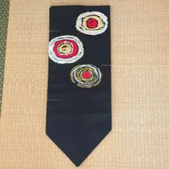 さ*ん様 未使用　しつけ糸がついたままの帯 黒地 円形模様　金糸使い