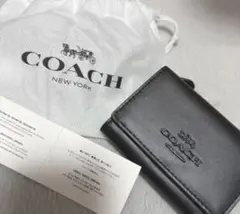 COACH ブラックフェイクレザー 三つ折り財布