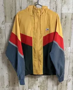 【美品】NIKE 筆記体ロゴ ナイロンJKウィンドランナー L マルチカラー