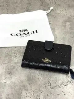COACH コーチブラックレザー 二つ折り財布 エンボス加工 ブラック
