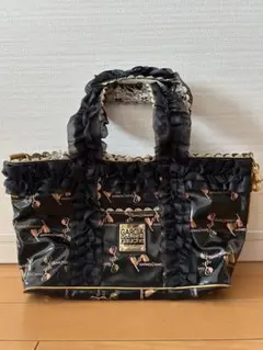 ガルシアマルケス　手提げバッグ　レース　フリル 黒×ゴールド×ピンクのサムネイル