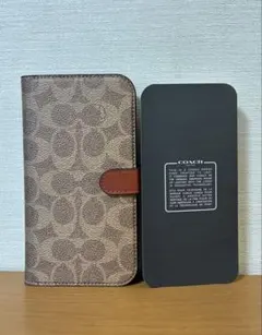 COACH iPhone13Pro ケース 手帳型 シグネチャー柄のサムネイル