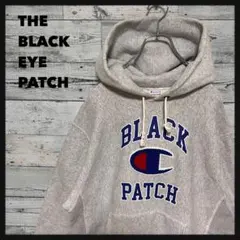 t168【希少】ブラックアイパッチ チャンピオン コラボ 刺繍 ロゴ パーカー