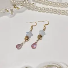 ピアス/イヤリング】猫とリンゴ 果物 ブルー 星 透明感 ラメ - メルカリ