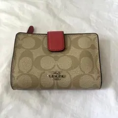 COACH 二つ折り財布 シグネチャー ピンク