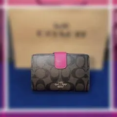 コーチ COACH シグネチャーレザーミディアム.ピンク二つ折り財布