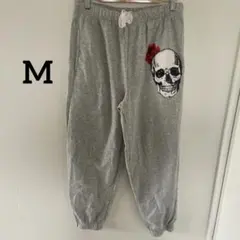 スカルとバラプリントのグレースウェットパンツM