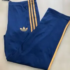 希少カラーオレンジGOLD×トレフォイルadidasオリジナルストラックパンツL