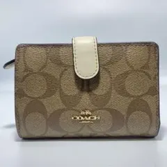 美品　COACH 二つ折り財布 ベージュ　シグネチャー