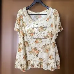 アクシーズファム⭐︎花柄ロゴ入りTシャツ⭐︎イエローフラワープリント 半袖レース付きのサムネイル