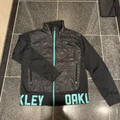 OAKLEY （オークリー）中綿切替ゴルフジャケット ブラック/ターコイズ