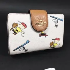 [新品未使用]COACH コーチスヌーピー 二つ折り財布のサムネイル