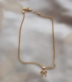 極美品NINA RICCI ニナリッチ ゴールドチェーン 赤リボンロゴ 高級本革 