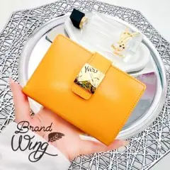 イヴサンローラン 財布 二つ折り がま口 ロゴ金具 ヴィンテージ 黄色 正規品